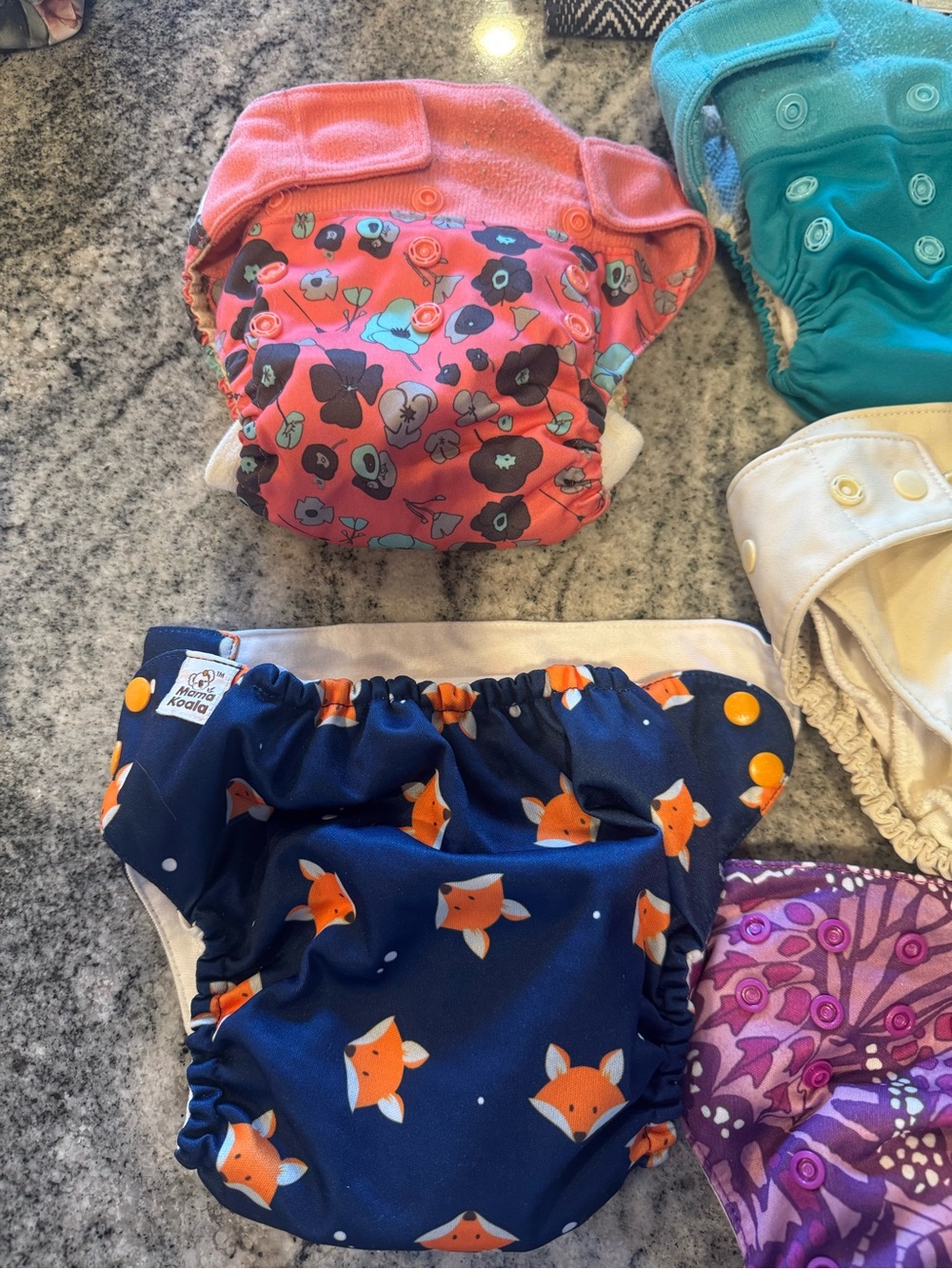 Bundle of 9 mostly Grovia cloth diapers with inserts included